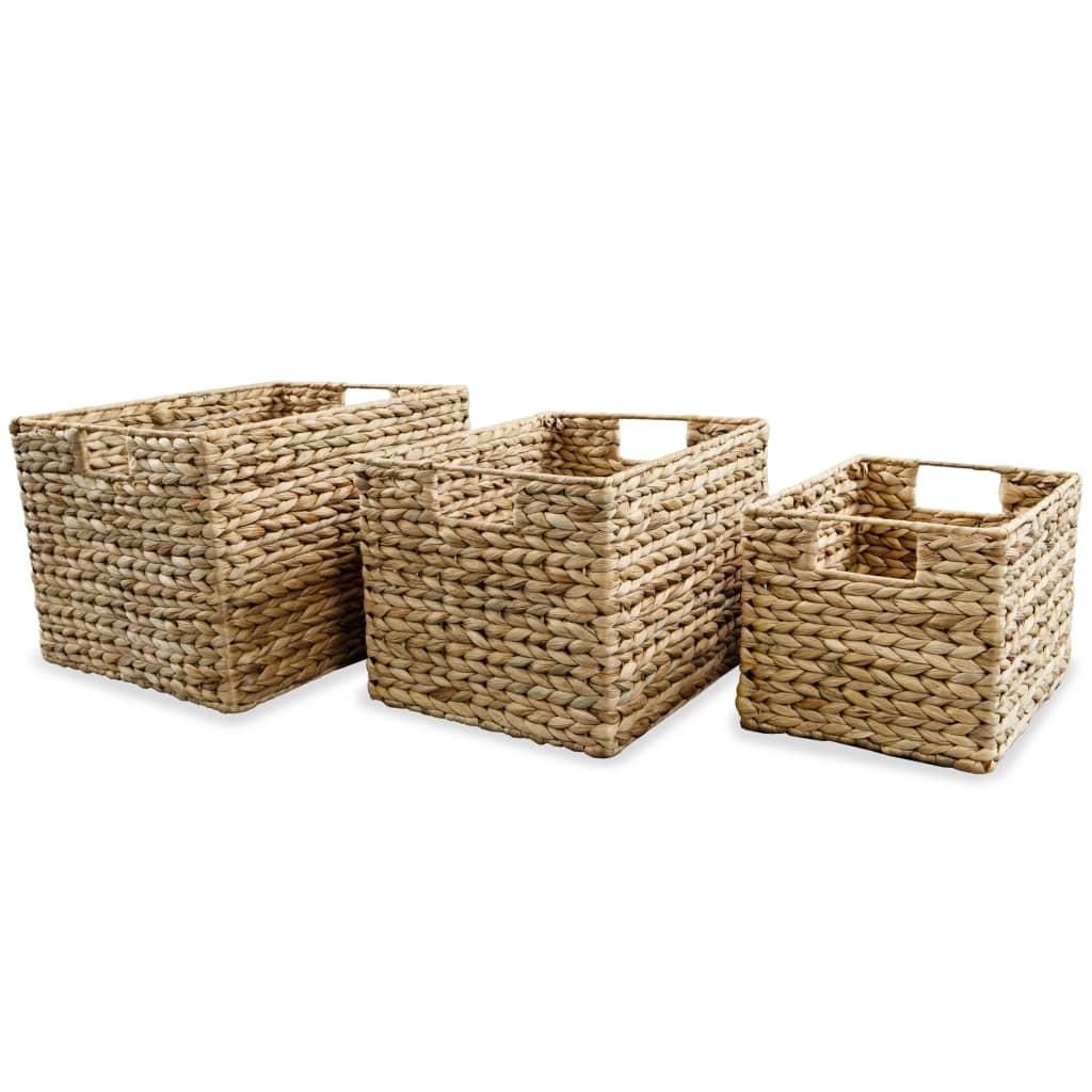 Three brown water hyacinth storage baskets of varying sizes with handles.