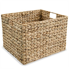 A set of three brown water hyacinth storage baskets in graduated sizes with handles.