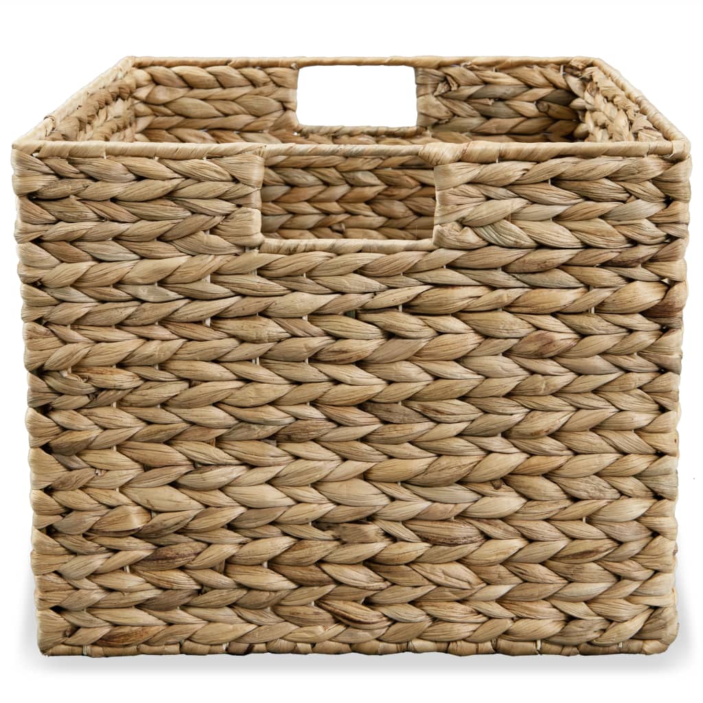 Set of three brown water hyacinth storage baskets in graduated sizes.
