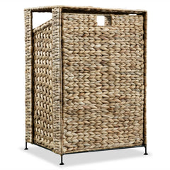 Brown woven water hyacinth laundry basket with removable liner on metal frame.