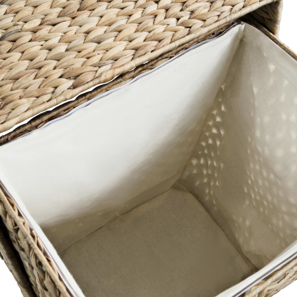 Brown woven water hyacinth laundry basket with removable liner.