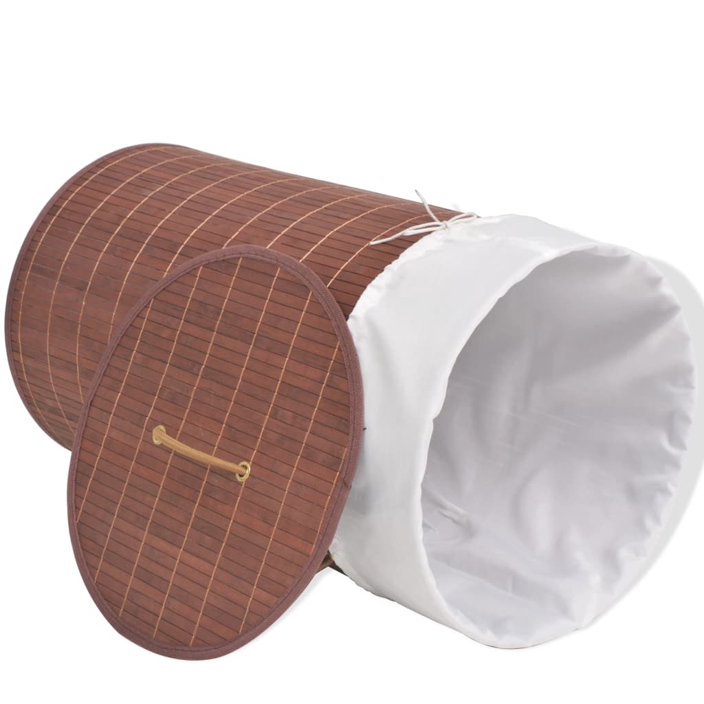 Brown bamboo round laundry hamper with a white liner and an open lid.