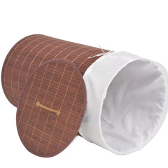 Brown bamboo round laundry hamper with a white liner and an open lid.