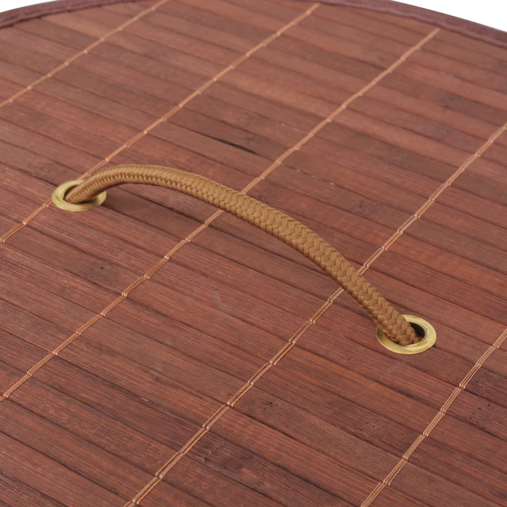 Round brown bamboo laundry hamper with braided handle.