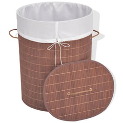 Oval brown bamboo laundry hamper with white liner and lid.