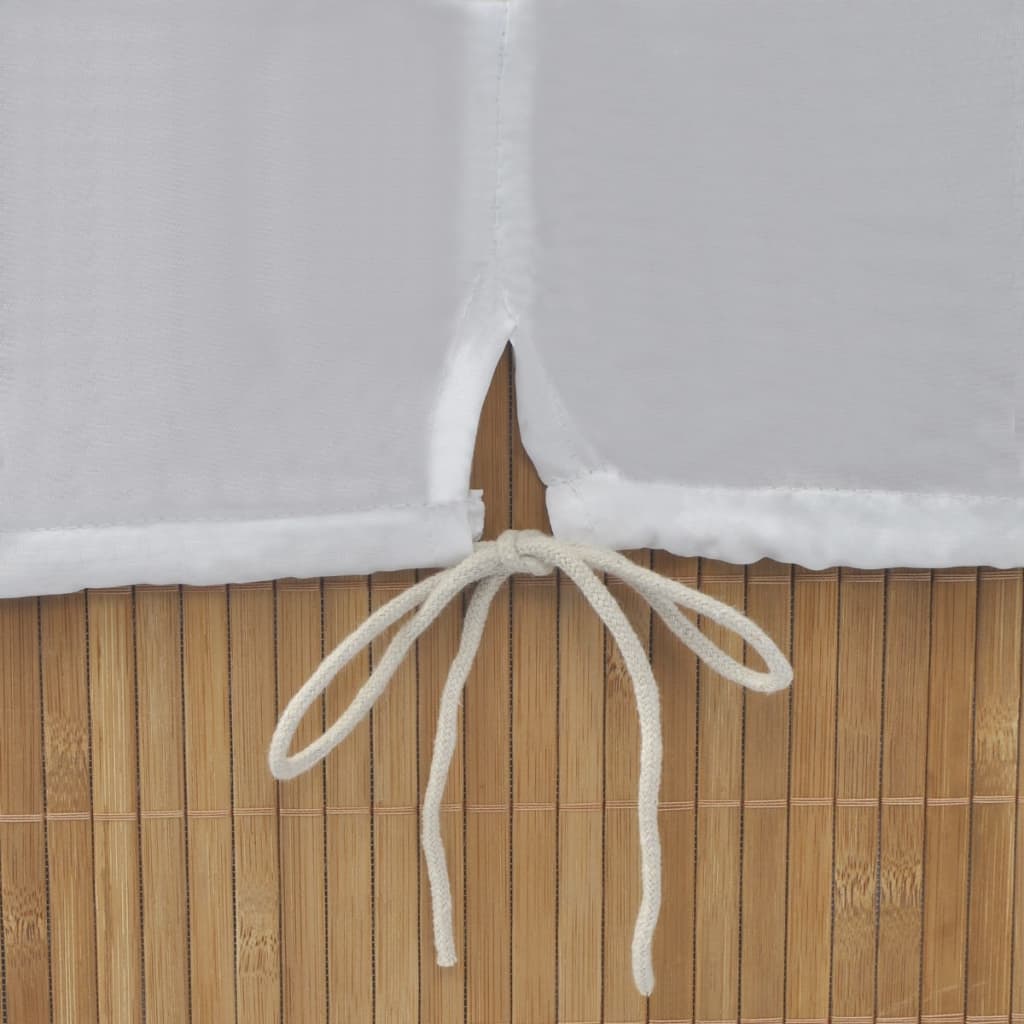 Natural bamboo rectangular laundry hamper with white removable liner and tie closure.