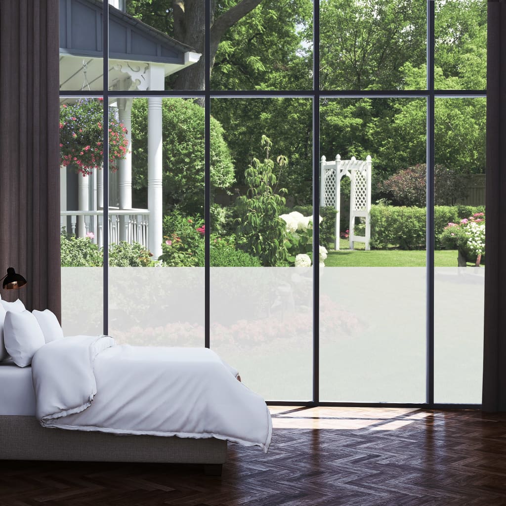 Frosted privacy window film applied to large home windows, diffusing light while obscuring outdoor views.