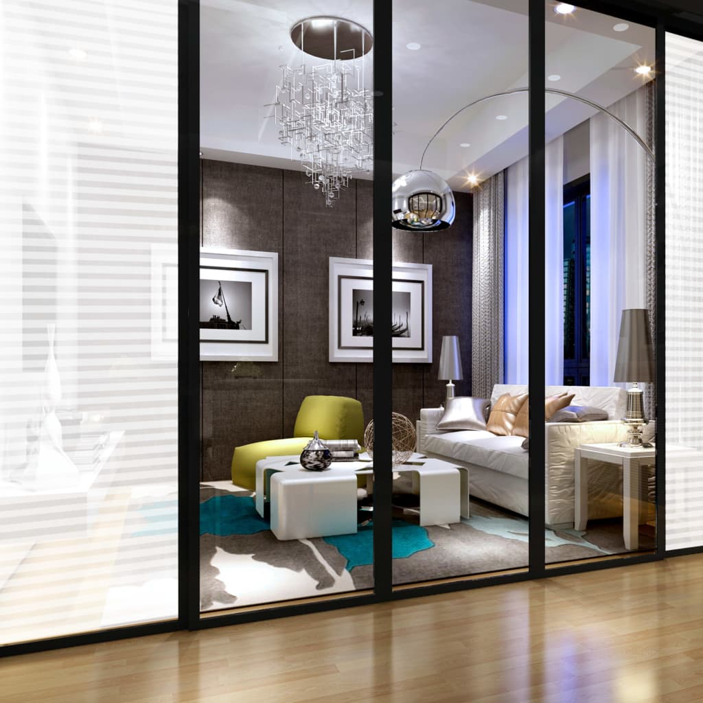 Frosted privacy window film with adhesive stripes applied to modern glass doors, diffusing light in a stylish living room.