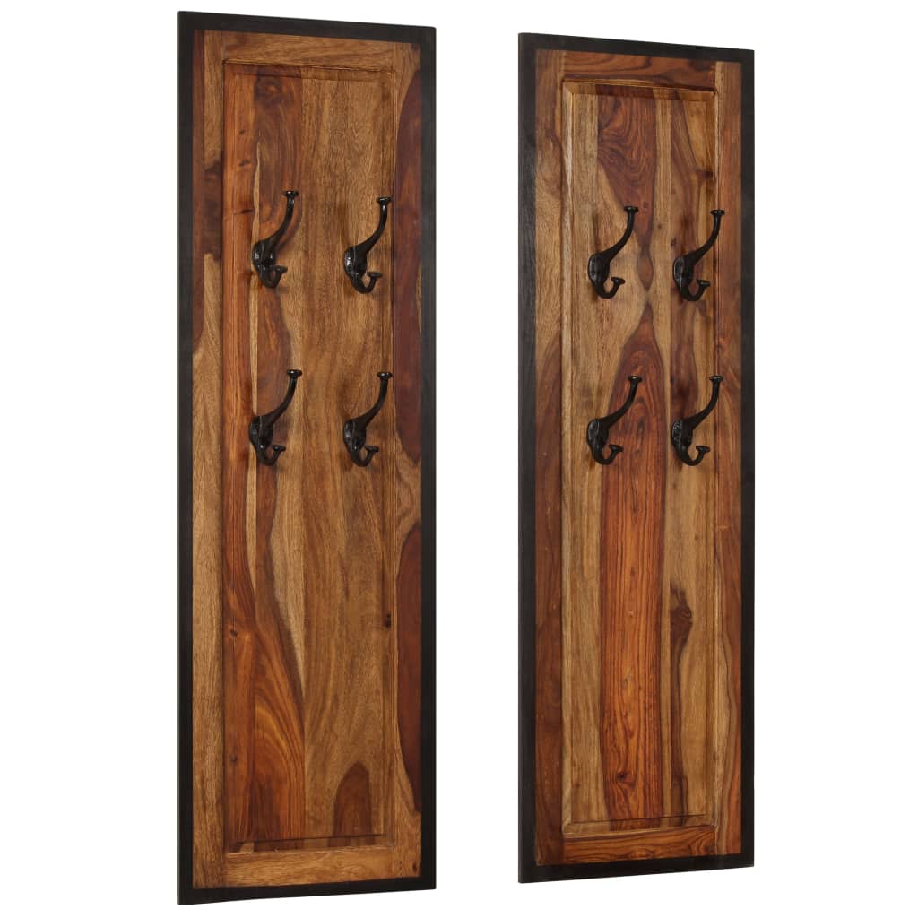 Two solid sheesham wood coat racks, each with four black hooks on a tall panel.