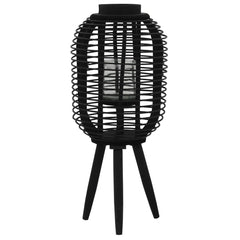 Black bamboo freestanding candle lantern holder with woven frame, glass jar, and tripod base.