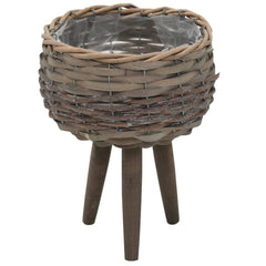 Brown wicker planter with PE lining and wooden legs on a white background.