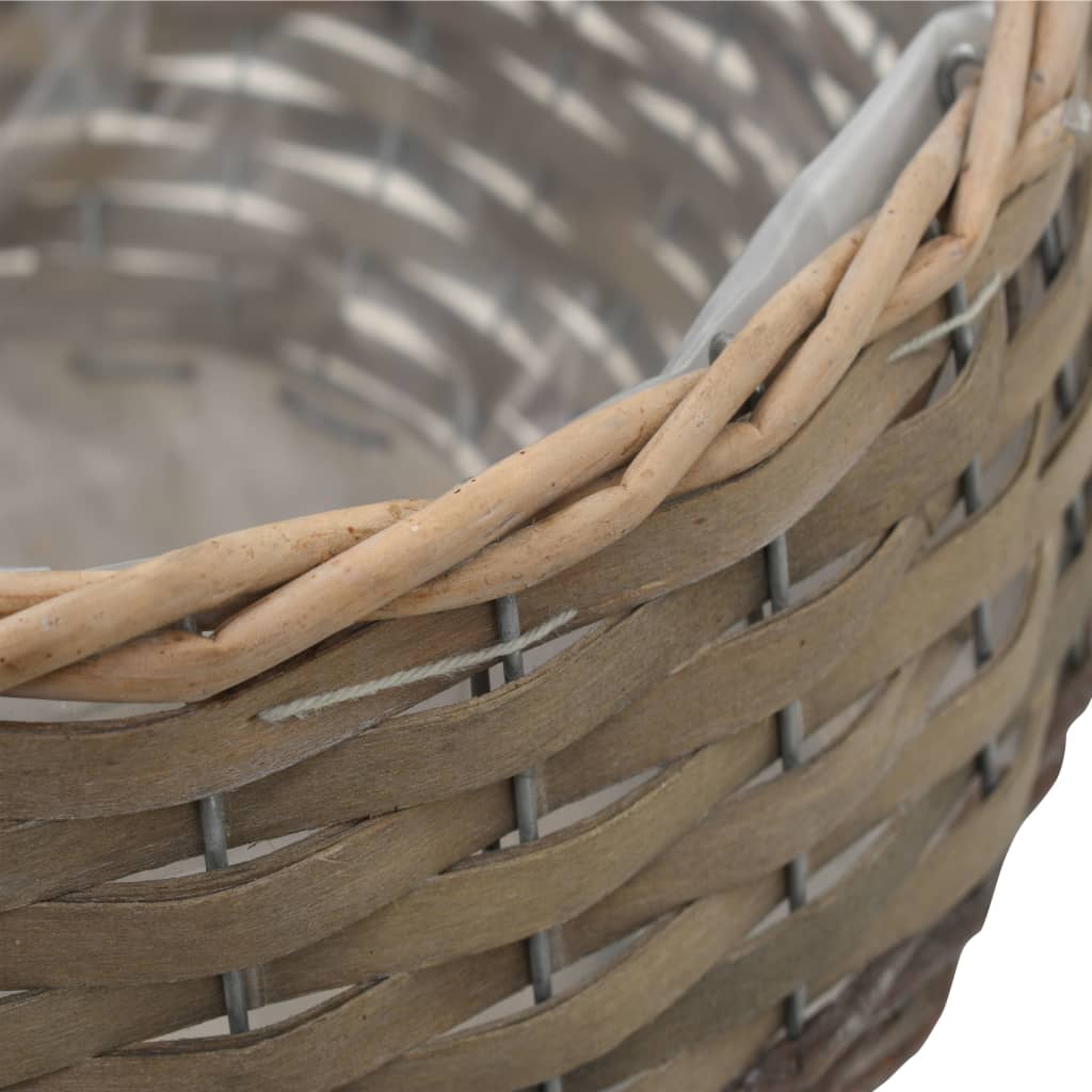 Brown 3-piece wicker planter set with PE lining, in graduated sizes.