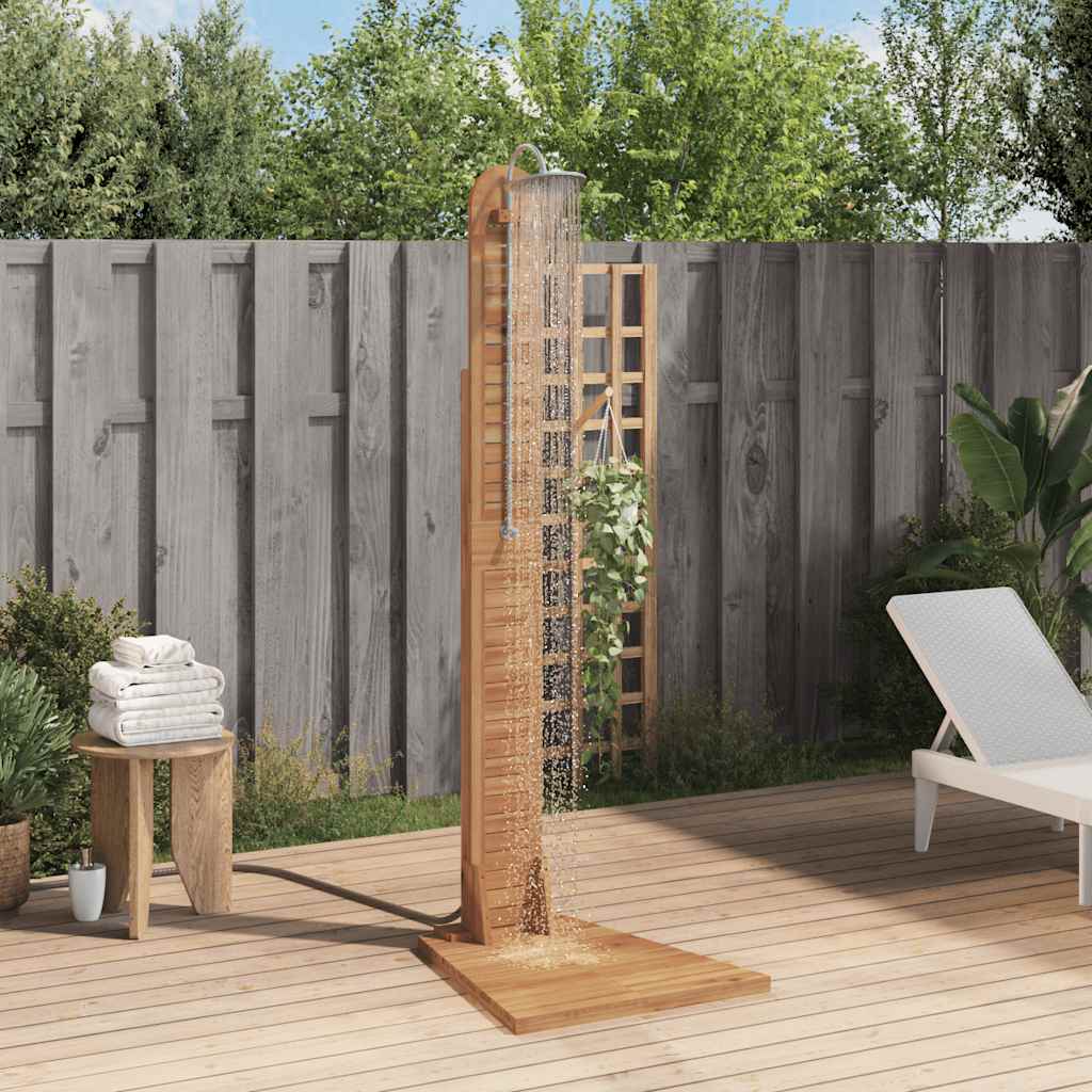 Solid teak garden shower with wooden frame, wide base, and shower head on a backyard deck.