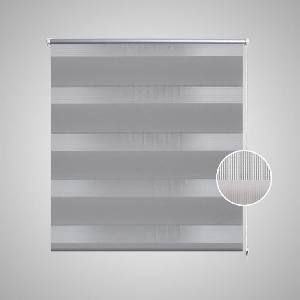 Gray zebra roller blind with alternating sheer and opaque polyester stripes and white pull chain.
