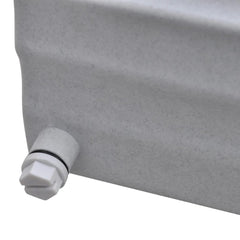 Close-up of a light gray plastic pool fountain with a white drain plug.
