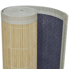 Rolled natural bamboo rectangular rug with gray non-skid backing.