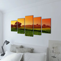 Five-panel canvas wall art print set depicting a sunset over green fields, measuring 39x20 inches.