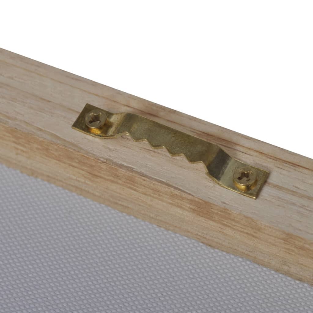 Close-up of gold sawtooth hanger on wooden frame of zebra canvas wall art.