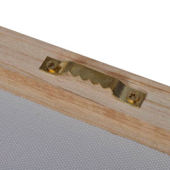 Close-up of gold sawtooth hanger on wooden frame of zebra canvas wall art.