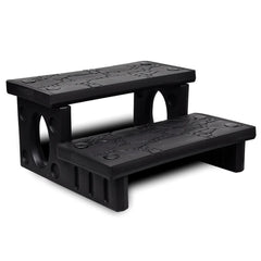 Black non-skid plastic spa steps with two treads for hot tub access.