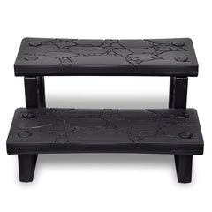 Black non-skid plastic spa steps with textured treads for hot tubs, featuring two levels and sturdy legs.