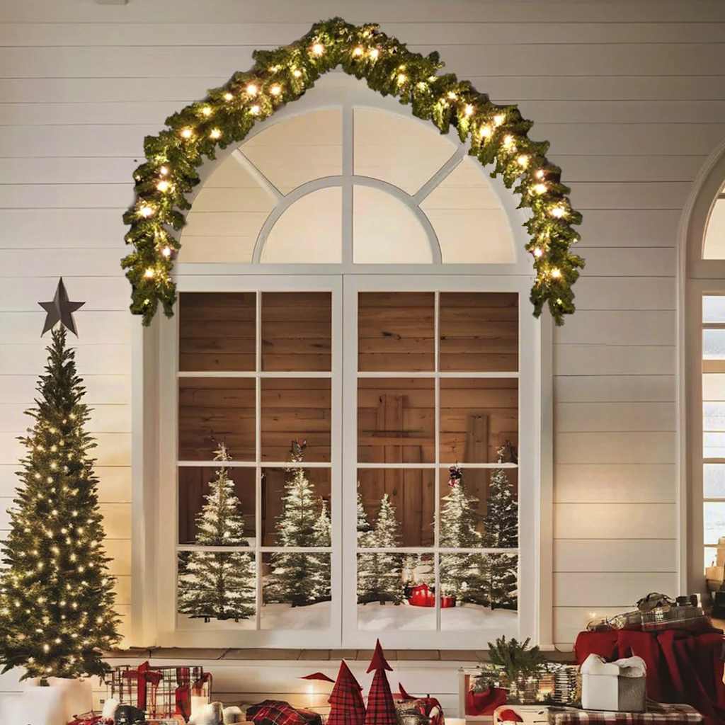 16ft Christmas garland with warm white LED lights draped over a window.