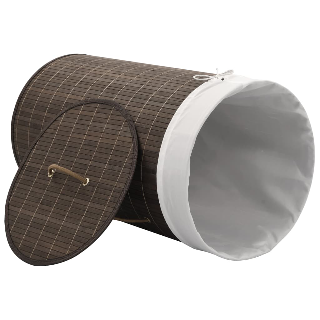 Dark brown round bamboo laundry hamper with removable liner and sturdy handles.