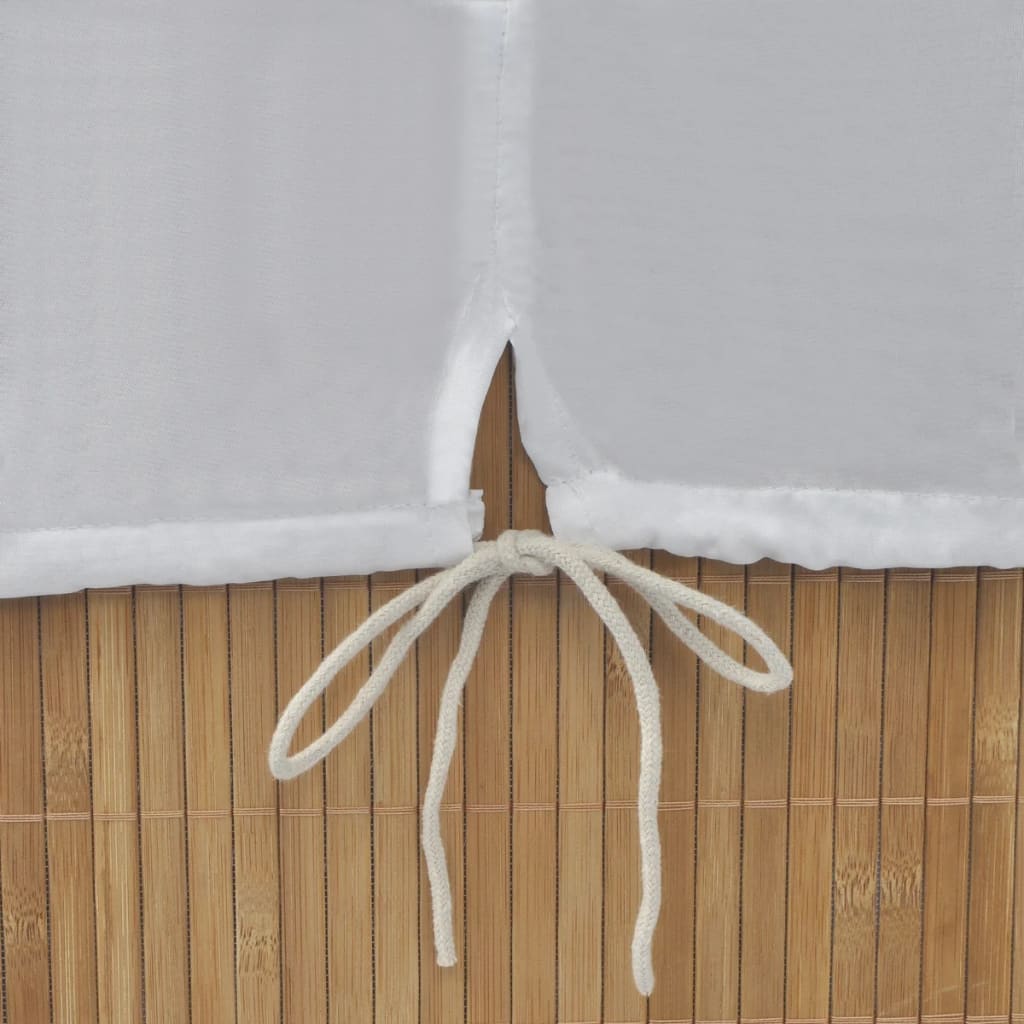 Rectangular natural bamboo laundry hamper with white drawstring liner.