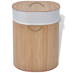 Oval natural bamboo laundry hamper with white liner and leather handles.