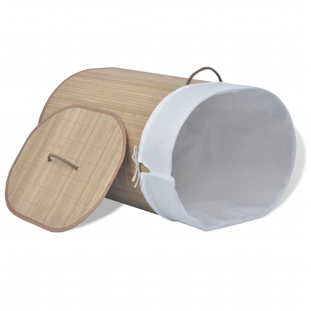 Oval natural bamboo laundry hamper with removable white liner and lid.