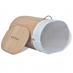 Oval natural bamboo laundry hamper with removable white liner and lid.