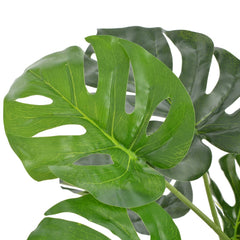 Artificial green Monstera plant in pot, 39.4 inches high with variegated leaves.