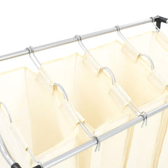 Cream steel laundry sorter with four removable fabric bags on a metal frame.