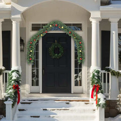 16 ft PVC Christmas garland with gold and red baubles draped on a snowy porch.