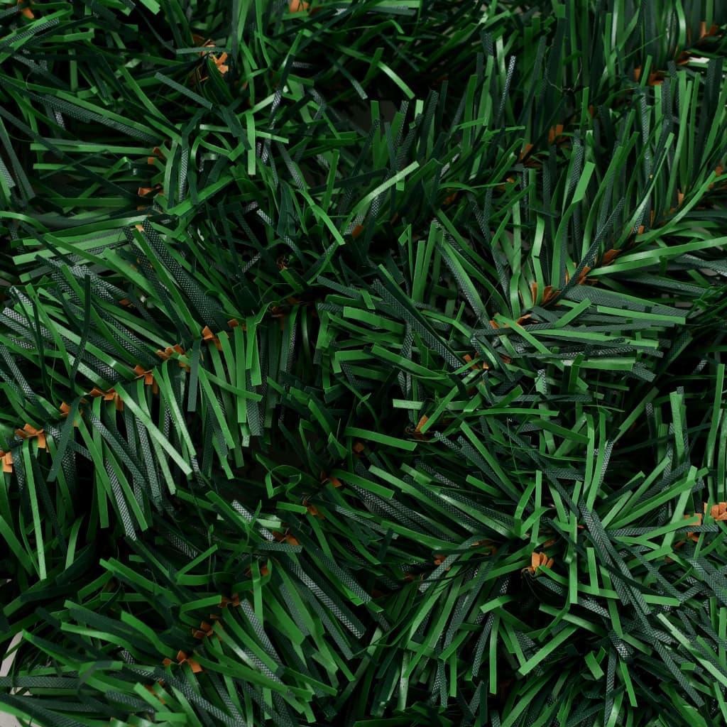 Close-up of green PVC artificial Christmas garland with fluffy branches.