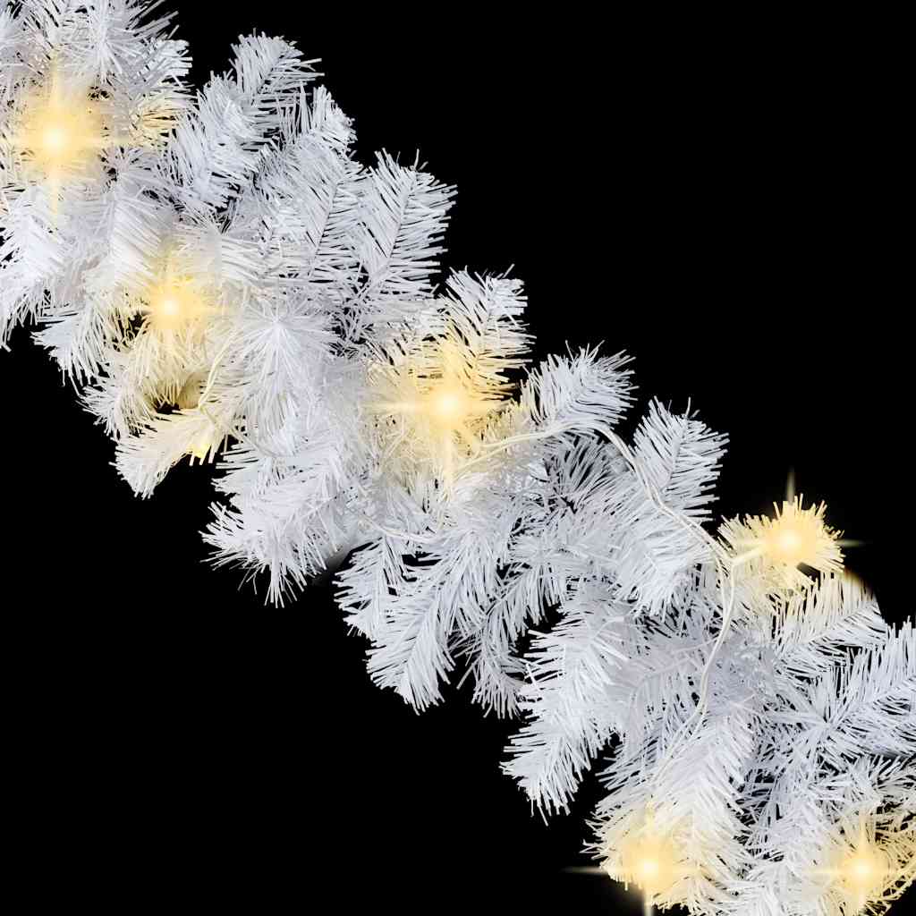 A 33 ft white Christmas garland with warm white LED lights glowing along its branches.