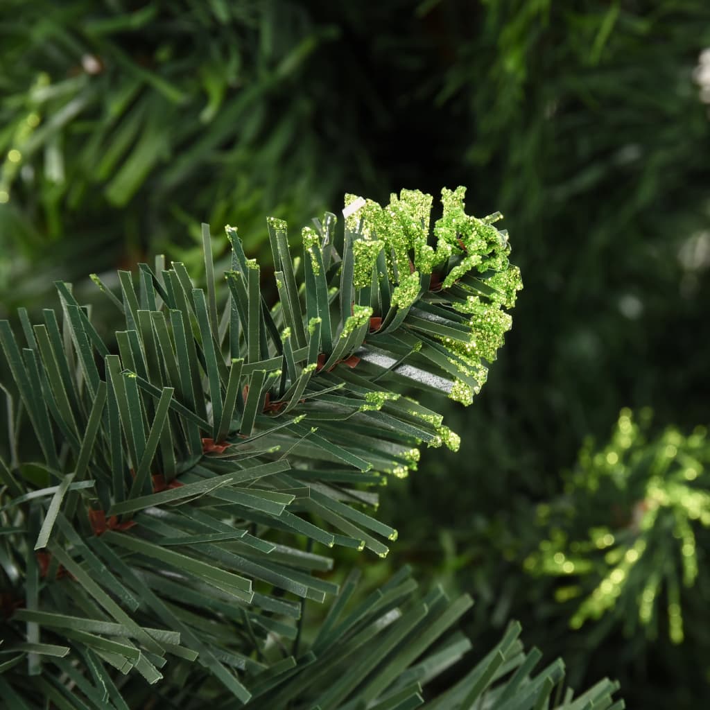 A close-up of green artificial pine branches and pine cones from a 7ft Christmas tree.