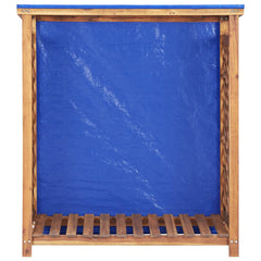 Wooden firewood storage shed with slatted acacia frame, blue tarp cover, and open sides.