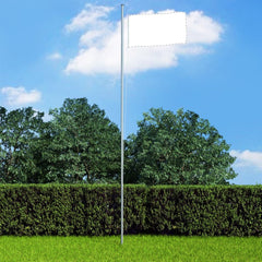 Silver 20.3-foot sectional aluminum flagpole in a yard with trees and hedge.