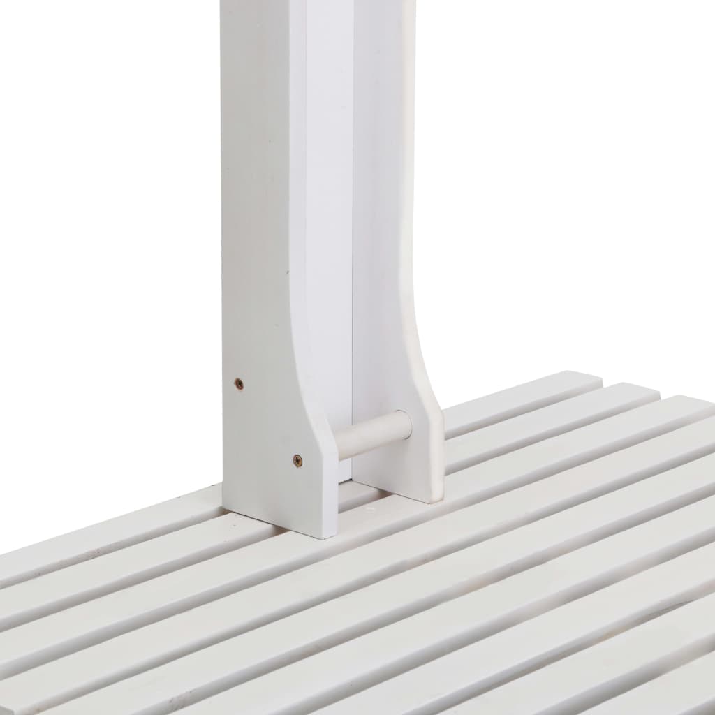 A close-up of the white wooden garden shower's slatted base and vertical support.