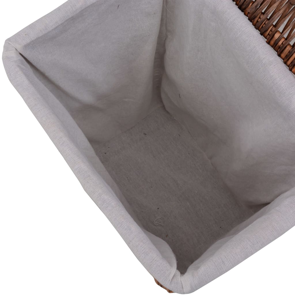 Brown woven willow laundry basket with linen lining, viewed from above.