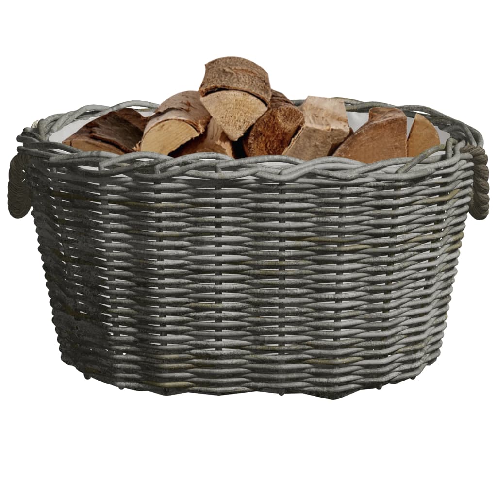 Gray woven willow firewood basket with handles, filled with wood logs.