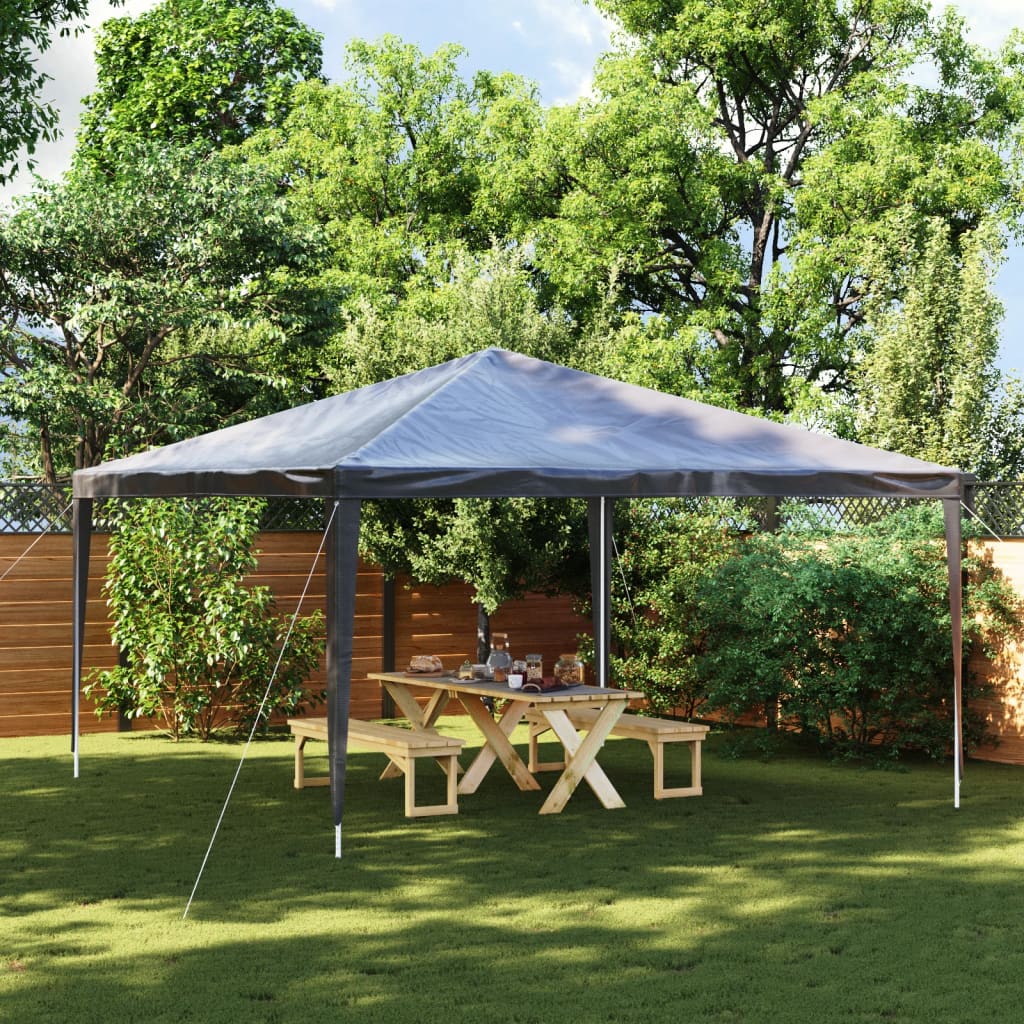 A 13.1x13.1 ft anthracite party tent with UV water-resistant canopy set up in a backyard over a picnic table.