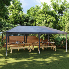 Anthracite 13.1'x19.7' party tent with UV and water-resistant canopy over wooden picnic tables in a backyard.