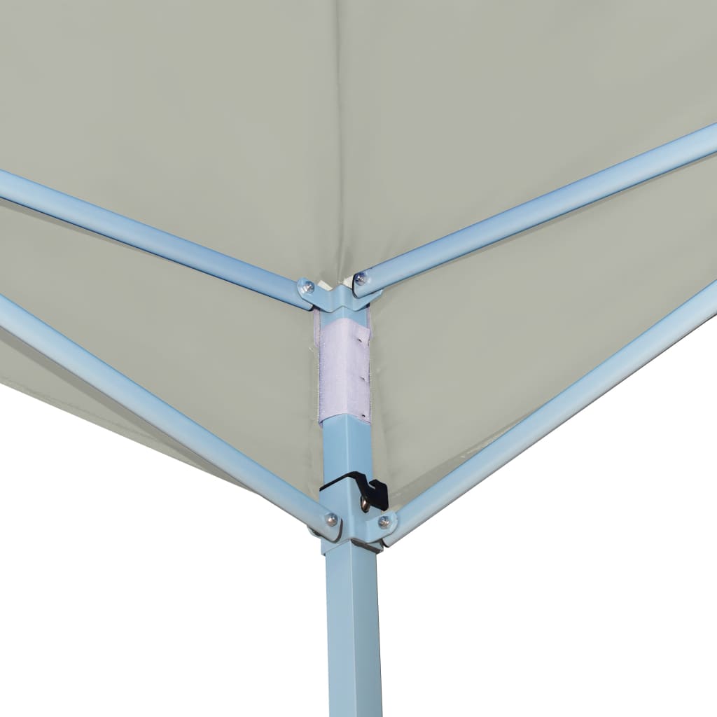 Cream folding gazebo with blue steel frame and white joint, showing corner detail.