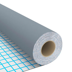 Rolled gray self-adhesive PVC furniture film on a grid surface.