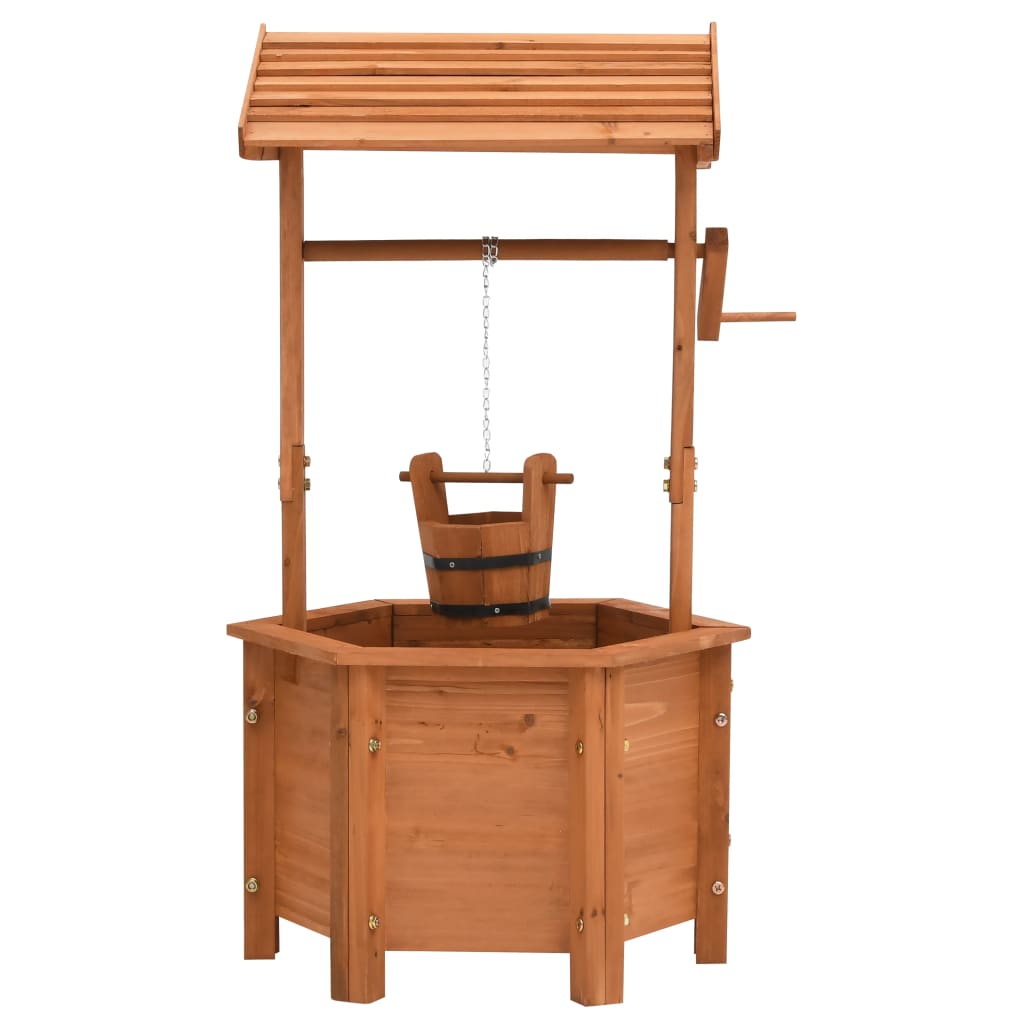 Wooden wishing well garden planter with hexagonal base, peaked roof, crank, and hanging bucket.