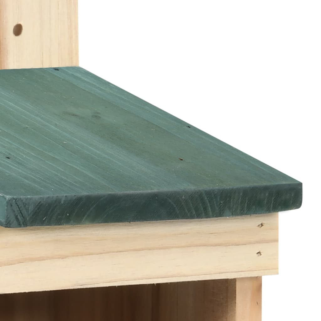 Wooden bird house with green sloped roof and natural firwood frame.