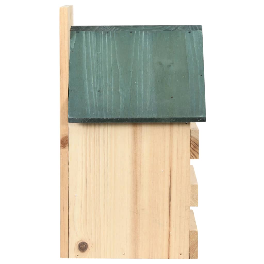 Four wooden bird houses with green roofs, side view showing slatted sides and firwood construction.