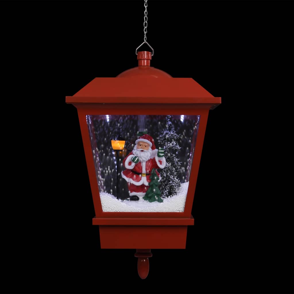 Red hanging Christmas lantern with LED lights, Santa figure, and swirling snow inside.